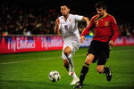 BLOEMFONTEIN, SOUTH AFRICA - JUNE 24:  Clint Dempsey of USA beats the challenge of Gerard Pique of Spain during the FIFA Confederations Cup Semi Final match between Spain and USA at Free State Stadium on June 24, 2009 in Bloemfontein, South Africa.  (Photo by Jamie McDonald/Getty Images)