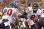 GREEN BAY - DECEMBER 7:  Quarterback Matt Schaub #8 of the Houston Texans moves to hand off the ball to Steve Slaton #20 during the game against the Green Bay Packers at Lambeau Field on December 7, 2008 in Green Bay, Wisconsin.  (Photo by: Jeff Gross/Getty Images)