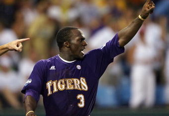 OMAHA, NE - JUNE 22:   Jared Mitchell #3 of the Louisiana State University Tigers points to teammate Mikie Mahtook after Mahtook drove in the game winning run in the 11th inning against the Texas Longhorns during Game 1 of the 2009 NCAA College World Series at Rosenblatt Stadium on June 22, 2009 in Omaha, Nebraska. The Tigers defeated the Longhorns 7-6 in 11 innings. (Photo by Elsa/Getty Images)