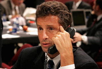 VANCOUVER, BC - JUNE 24:  General manager Doug Wilson of the San Jose Sharks talks on the phone during the 2006 NHL Draft held at General Motors Place on June 24, 2006 in Vancouver, Canada.   (Photo by Bruce Bennett/Getty Images)