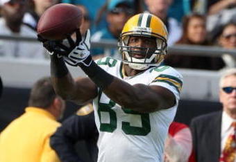 JACKSONVILLE, FL - DECEMBER 14:  Greg Jennings #85 makes a reception during the game against the Jacksonville Jaguars at Jacksonville Municipal stadium on December 14, 2008 in Jacksonville, Florida.  (Photo by Sam Greenwood/Getty Images)