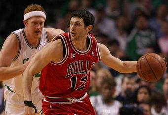 BOSTON - MAY 02:  Kirk Hinrich #12 of the Chicago Bulls heads down court as Brian Scalabrine #44 of the Boston Celtics defends in Game Seven of the Eastern Conference Quarterfinals during the 2009 NBA Playoffs at TD Banknorth Garden on May 2, 2009 in Boston, Massachusetts. The Celtics defeated the Bulls 109-99. NOTE TO USER: User expressly acknowledges and agrees that, by downloading and or using this photograph, User is consenting to the terms and conditions of the Getty Images License Agreement.  (Photo by Elsa/Getty Images)