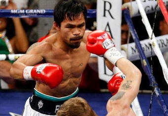 LAS VEGAS - MAY 02:  (L-R) Manny Pacquiao of the Philippines knocks down Ricky Hatton of England during their junior welterweight title fight at the MGM Grand Garden Arena May 2, 2009 in Las Vegas, Nevada.  (Photo by Ethan Miller/Getty Images)