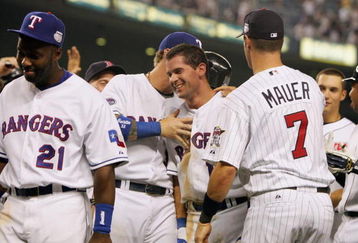 NEW YORK - JULY 15:  Micheal Young #10 is congratulated by Josh Hamilton #32 and  Joe Mauer #7 during the 79th MLB All-Star Game at Yankee Stadium on July 15, 2008 in the Bronx borough of New York City. (Photo by: Jim McIsaac/Getty Images)