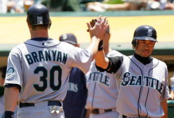OAKLAND, CA - MAY 27:  Russell Branyan #30 of the Seattle Mariners is congratulated by Ichiro Suzuki #51  after he scored in the second inning of their game against the Oakland Athletics at the Oakland Coliseum on May 27, 2009 in Oakland, California.  (Photo by Ezra Shaw/Getty Images)
