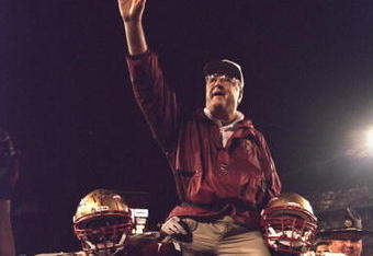 1 Jan 1996:  Head coach Bobby Bowden of the Florida State Seminoles is carried triumphantly off the field by nose guard Andre Wadsworth #8 and tackle Orpheus Roy after defeating the Notre Dame Fighting Irish in the Orange Bowl in Miami, Florida 31-26.  Ma