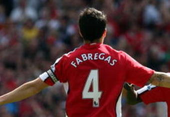 LONDON - APRIL 26:  Cesc Fabregas of Arsenal celebrates with his team mate Emmanuel Eboue after Fabregas scored the second goal during the Barclays Premier League match between Arsenal and Middlesbrough at Emirates Stadium on April 26, 2009 in London, England.  (Photo by Hamish Blair/Getty Images)