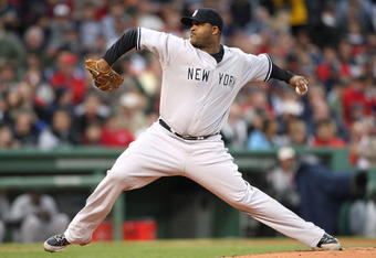 BOSTON - JUNE 11: CC Sabathia #52 of  New York Yankees throws against the Boston Red Sox at Fenway Park on June 11, 2009 in Boston, Massachusetts.  (Photo by Jim Rogash/Getty Images)