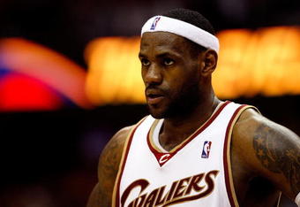 CLEVELAND - MAY 28:  LeBron James #23 of the Cleveland Cavaliers looks on between plays against the Orlando Magic in Game Five of the Eastern Conference Finals during the 2009 Playoffs at Quicken Loans Arena on May 28, 2009 in Cleveland, Ohio. NOTE TO USER: User expressly acknowledges and agrees that, by downloading and or using this photograph, User is consenting to the terms and conditions of the Getty Images License Agreement  (Photo by Gregory Shamus/Getty Images)