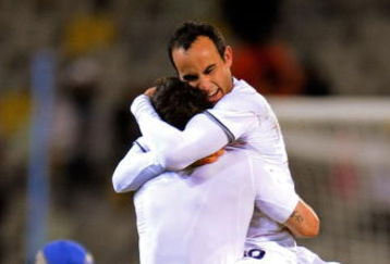 BLOEMFONTEIN, SOUTH AFRICA - JUNE 24:  Landon Donovan of USA jumps into the arms of teammate Carlos Bocanegra in celebration of their team's 2:0 victory over Spain at the close of the FIFA Confederations Cup Semi Final match between Spain and USA at the Free State stadium on June 24, 2009 in Bloemfontein, South Africa.  (Photo by Kevork Djansezian/Getty Images)