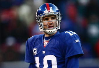 EAST RUTHERFORD, NJ -  JANUARY 11:  Eli Manning #10 of the New York Giants looks on against the Philadelphia Eagles during the NFC Divisional Playoff Game on January 11, 2009 at Giants Stadium in East Rutherford, New Jersey.  The Eagles defeated the Giants 23 -11. (Photo by Chris McGrath/Getty Images)