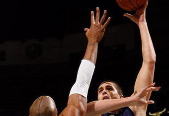 NEW ORLEANS - DECEMBER 07:  Darko Milicic #31 of the Memphis Grizzlies makes a shot over David West #30 of the New Orleans Hornets on December 7, 2007 at the New Orleans Arena in New Orleans, Louisiana.  The Hornets defeated the Grizzlies 118-116.    NOTE TO USER: User expressly acknowledges and agrees that, by downloading and/or using this Photograph, user is consenting to the terms and conditions of the Getty Images License Agreement.  (Photo by Chris Graythen/Getty Images)