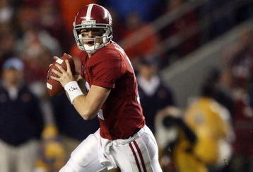 TUSCALOOSA, AL - NOVEMBER 29:  Quarterback Greg McElroy #12 of the Alabama Crimson Tide rolls out to pass against the Auburn Tigers at Bryant-Denny Stadium on November 29, 2008 in Tuscaloosa, Alabama. Alabama defeated Auburn 36-0.  (Photo by Doug Benc/Getty Images)