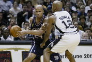 SAN ANTONIO, TX - JUNE 15: Richard Jefferson #24 of the New Jersey Nets attempts to drive around Bruce Bowen #12 of the San Antonio Spurs in game six of the 2003 NBA Finals on June 15, 2003 at the SBC Center in San Antonio, Texas. The Spurs won 88-77 and defeated the Nets to win the NBA Championship. NOTE TO USER: User expressly acknowledges and agrees that, by downloading and/or using this Photograph, User is consenting to the terms and conditions of the Getty Images License Agreement. (Photo by Ezra Shaw/Getty Images)