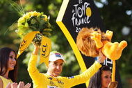 PARIS - JULY 27:  Yellow Jersey overall race winner Carlos Sastre of Spain and Team CSC Saxobank celebrates on the podium during Stage Twenty One of the Tour de France on July 27, 2008 in Paris, France.  (Photo by Jasper Juinen/Getty Images)