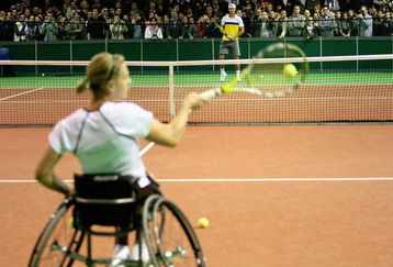 ROTTERDAM, NETHERLANDS - FEBRUARY 10:  Champion wheelchair tennis player Esther Vergeer of Netherlands returns a ball to Rafael Nadal of Spain  during day two of the ABN AMRO World Tennis Tournament at the Ahoy Centre Rotterdam on February 10, 2009 in Rotterdam, Netherlands.  (Photo by Hamish Blair/Getty Images)