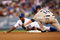 LOS ANGELES - JUNE 10: Juan Pierre #9 of the Los Angeles Dodgers slides into second with a stoloen base ahead of the tag of shortstop Josh Wilson #14 of the San Diego Padres in the first inning on June 10, 2009 at Dodger Stadium in Los Angeles, California.  (Photo by Stephen Dunn/Getty Images)