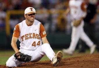 OMAHA, NE - JUNE 24:  Austin Wood #44 of the Texas Longhorns winces after getting hit by a ball against the Louisiana State University Tigers during Game 3 of the 2009 NCAA College World Series at Rosenblatt Stadium on June 24, 2009 in Omaha, Nebraska. The Tigers defeated the Longhorns 11-4 to win the national title.  (Photo by Elsa/Getty Images)