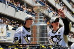 PITTSBURGH - JUNE 15:  Marc-Andre Fleury #29 and Sidney Crosby #87 of the Pittsburgh Penguins show off the Stanley Cup to the crowd on the Blvd of the Allies during the Stanley Cup Champion Victory Parade on June 15, 2009 in Pittsburgh, Pennsylvania.  (Photo by Jamie Sabau/Getty Images)