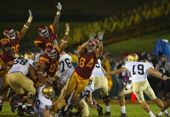 LOS ANGELES - NOVEMBER 27:  The USC Trojans attempt to block a field goal from kicker D.J. Fitzpatrick #19 the Notre Dame Fighting Irish on November 27, 2004 at the Los Angeles Coliseum in Los Angeles, California. USC won 41-10.  (Photo by Christian Petersen/Getty Images) 