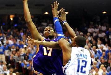 ORLANDO, FL - JUNE 14:  Andrew Bynum #17 of the Los Angeles Lakers goes up for a shot over Dwight Howard #12 of the Orlando Magic in the second quarter of Game Five of the 2009 NBA Finals on June 14, 2009 at Amway Arena in Orlando, Florida.  NOTE TO USER:  User expressly acknowledges and agrees that, by downloading and or using this photograph, User is consenting to the terms and conditions of the Getty Images License Agreement.  (Photo by Ronald Martinez/Getty Images)