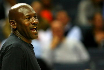 CHARLOTTE, NC - NOVEMBER 03:  Michael Jordan, part owner of the Charlotte Bobcats, smiles from the bench during their game against the Detroit Pistons at Time Warner Cable Arena on November 3, 2008 in Charlotte, North Carolina. NOTE TO USER: User expressly acknowledges and agrees that, by downloading and or using this photograph, User is consenting to the terms and conditions of the Getty Images License Agreement.  (Photo by Streeter Lecka/Getty Images)