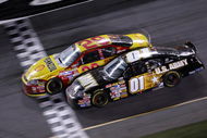 DAYTONA, FL - FEBRUARY 18:  Kevin Harvick, driver of the #29 Shell/Pennzoil Chevrolet, leads Mark Martin, driver of the #01 U.S. ARMY Chevrolet, to the finish line to win the NASCAR Nextel Cup Series Daytona 500 at Daytona International Speedway on February 18, 2007 in Daytona, Florida.  (Photo by Jonathan Ferrey/Getty Images for NASCAR)
