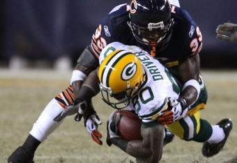 CHICAGO - DECEMBER 22: Charles Tillman #33 of the Chicago Bears brings down Donald Driver #80 of the Green Bay Packers on December 22, 2008 at Soldier Field in Chicago, Illinois. The Bears defeated the Packers 20-17 in overtime. (Photo by Jonathan Daniel/Getty Images)