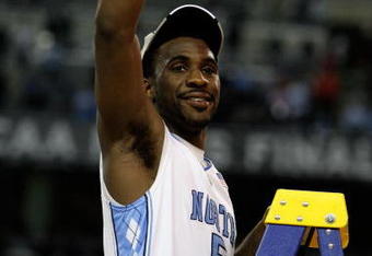 DETROIT - APRIL 06:  Ty Lawson of the North Carolina Tar Heels celebrates as he gets set to cut down a piece of the net following their 89-72 win against the Michigan State Spartans during the 2009 NCAA Division I Men's Basketball National Championship game at Ford Field on April 6, 2009 in Detroit, Michigan.  (Photo by Andy Lyons/Getty Images)