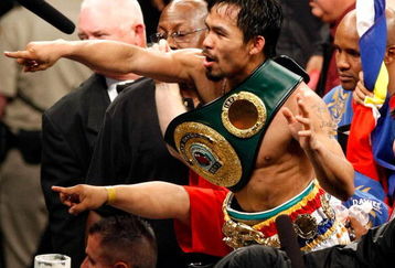 LAS VEGAS - MAY 02:  Manny Pacquiao of the Philippines celebrates after knocking out Ricky Hatton of England in the second round of their junior welterweight title fight at the MGM Grand Garden Arena May 2, 2009 in Las Vegas, Nevada.  (Photo by Ethan Miller/Getty Images)