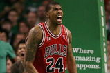 BOSTON - APRIL 28: Tyrus Thomas #24 of the Chicago Bulls celebrates after his dunk as Glen Davis #11 of the Boston Celtics looks on in Game Five of the Eastern Conference Quarterfinals during the 2009 NBA Playoffs at TD Banknorth Garden on April 28, 2009 in Boston, Massachusetts. NOTE TO USER: User expressly acknowledges and agrees that, by downloading and or using this photograph, User is consenting to the terms and conditions of the Getty Images License Agreement.  (Photo by Elsa/Getty Images)