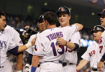 NEW YORK - JULY 15:  Micheal Young #10 is congratulated Justin Morneau #33 during the 79th MLB All-Star Game at Yankee Stadium on July 15, 2008 in the Bronx borough of New York City. (Photo by: Jim McIsaac/Getty Images)