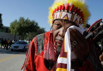 MIAMI - DECEMBER 03:  Washington Redskins 'unofficial' mascot Zema Williams known as Chief Zee wipes his face as he arrives for the funeral of Redskins football player, Sean Taylor, at the Pharmed Arena at Florida International University December 3, 2007 in Miami, Florida. Taylor died November 27, one day after being shot at his home in Miami.  (Photo by Joe Raedle/Getty Images)