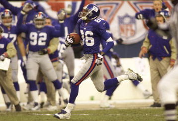 7 Jan 2001:  Ron Dixon #86 of the New York Giants returns the opening kickoff for a touchdown against the Philadelphia Eagles during the NFC Divisional playoff game at Giants Stadium in East Rutherford, New Jersey. <Digital File>  Mandatory Credit: Al Bello/ALLSPORT