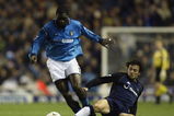MANCHESTER - DECEMBER 23:  Marc Vivien Foe of Manchester City takes the ball past Simon Davies of Tottenham Hotspur during the FA Barclaycard Premiership match held on December 23, 2002 at Maine Road, in Manchester, England. Tottenham Hotspur won the match 3-2. (Photo by Gary M. Prior/Getty Images)