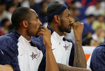 SHANGHAI, CHINA - AUGUST 05:  Kobe Bryant #10 and LeBron James #6 of the USA Basketball Men's Senior National Team sit on the bench during the USA Basketball International Challenge exhibition game against the Australia National Team at the Qizhong Arena on August 5, 2008 in Shanghai, China.  (Photo by MN Chan/Getty Images)