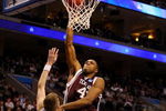 PHILADELPHIA - MARCH 19:  Chinemelu Elonu #41 of the Texas A&M Aggies shoots against Lee Cummard #30 of the Brigham Young Cougars during the first round of the NCAA Division I Men's Basketball Tournament at the Wachovia Center on March 19, 2009 in Philadelphia, Pennsylvania.  (Photo by Jim McIsaac/Getty Images)