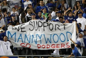 LOS ANGELES - MAY 7:  Fans hold a smuggled in banner supporting suspended Dodger Manny Ramirez during the seventh inning stretch of the game between the Los Angeles Dodgers the Washington Nationals on May 7, 2009 at Dodger Stadiium in Los Angeles, California.  All banners are prohibited in Dodger Stadium.  (Photo by Stephen Dunn/Getty Images)