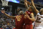 MINNEAPOLIS - MARCH 20:  DeMar DeRozan #10 and Daniel Hackett #13 of the USC Trojans fight for a rebound against Josh Southern #52 of the Boston College Eagles during the first round of the NCAA Division I Men's Basketball Tournament at the Hubert H. Humphrey Metrodome on March 20, 2009 in Minneapolis, Minnesota. USC won 72-55. (Photo by Jonathan Daniel/Getty Images)