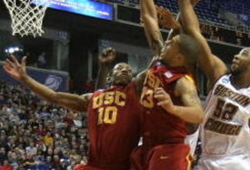 MINNEAPOLIS - MARCH 20:  DeMar DeRozan #10 and Daniel Hackett #13 of the USC Trojans fight for a rebound against Josh Southern #52 of the Boston College Eagles during the first round of the NCAA Division I Men's Basketball Tournament at the Hubert H. Humphrey Metrodome on March 20, 2009 in Minneapolis, Minnesota. USC won 72-55. (Photo by Jonathan Daniel/Getty Images)