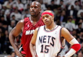 EAST RUTHERFORD, NJ - APRIL 28:  Vince Carter #15 of the New Jersey Nets and Shaquille O'Neal #32 of the Miami Heat look on during a break in Game three of the Eastern Conference Quarterfinals during the 2005 NBA Playoffs at Continental Airline Arena on April 28, 2005 in East Rutherford, New Jersey. The Heat defeated the Nets 108-105 in double overtime.  NOTE TO USER: User expressly acknowledges and agrees that, by downloading and/or using this Photograph, user is consenting to the terms and conditions of the Getty Images License Agreement.  (Photo by Jim McIsaac/Getty Images)