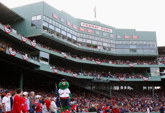 BOSTON - OCTOBER 13:  The Boston Red Sox mascot, Wally the Green Monster stands on the dugout inbetween innings of game three of the American League Championship Series against the Tampa Bay Rays during the 2008 MLB playoffs at Fenway Park on October 13, 2008 in Boston, Massachusetts.  (Photo by Jim Rogash/Getty Images)