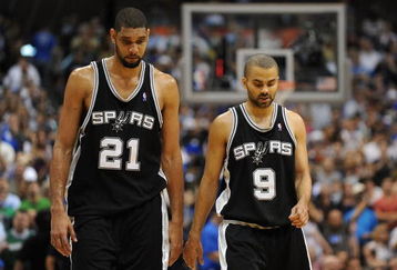 DALLAS - APRIL 25:  Forward Tim Duncan #21 and Tony Parker #9 of the San Antonio Spurs during a 99-90 loss against the Dallas Mavericks in Game Four of the Western Conference Quarterfinals during the 2009 NBA Playoffs at American Airlines Center on April 25, 2009 in Dallas, Texas. NOTE TO USER: User expressly acknowledges and agrees that, by downloading and or using this photograph, User is consenting to the terms and conditions of the Getty Images License Agreement.  (Photo by Ronald Martinez/Getty Images)