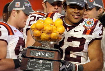 MIAMI - JANUARY 01:  Darren Evans #32 of the Virginia Tech Hokies celebrates with his MVP trophy after he and his team won the FedEx Orange Bowl against the Cincinnati Bearcats at Dolphin Stadium on January 1, 2009 in Miami, Florida.  (Photo by Streeter Lecka/Getty Images)