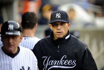 NEW YORK - JUNE 13:  Joe Girardi #27 of the New York Yankees walks through the dugout in a game against the New York Mets on June 13, 2009 at Yankee Stadium in the Bronx Borough of New York City.  (Photo by Jeff Zelevansky/Getty Images)
