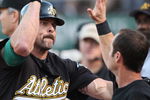 OAKLAND, CA - JUNE 23: Jason Giambi #16 of the Oakland Athletics is congratulated after hitting a home run against the San Francisco Giants during a Major League Baseball game on June 23, 2009 at the Oakland Coliseum in Oakland, California. (Photo by Jed Jacobsohn/Getty Images)