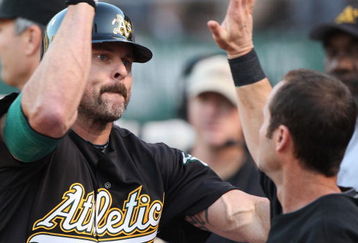 OAKLAND, CA - JUNE 23: Jason Giambi #16 of the Oakland Athletics is congratulated after hitting a home run against the San Francisco Giants during a Major League Baseball game on June 23, 2009 at the Oakland Coliseum in Oakland, California. (Photo by Jed Jacobsohn/Getty Images)