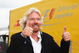 NORTHAMPTON, UNITED KINGDOM - JUNE 21: Sir Richard Branson is seen in the paddock before the British Formula One Grand Prix at Silverstone on June 21, 2009 in Northampton, England. (Photo by Clive Mason/Getty Images)