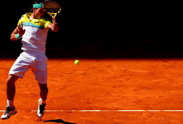 MADRID, SPAIN - MAY 16:  Rafael Nadal of Spain jumps to play a forehand to Novak Djokovic of Serbia in his semi-final match during the Madrid Open tennis tournament at the Caja Magica on May 16, 2009 in Madrid, Spain. Nadal won the match in three sets, 3-6, 7-6 and 7-6.  (Photo by Jasper Juinen/Getty Images)