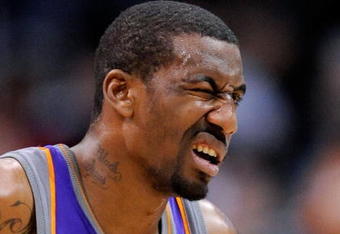 LOS ANGELES, CA - FEBRUARY 18:  Amar'e Stoudamire #1 of the Phoenix Suns reacts after getting a finger in his left eye during the first half against Los Angeles Clippers at the Staples Center on February 18, 2009 in Los Angeles, California. Stoudamire scored a game high 42 points and the Suns won, 142-119. NOTE TO USER: User expressly acknowledges and agrees that, by downloading and or using this photograph, User is consenting to the terms and conditions of the Getty Images License Agreement.  (Photo by Kevork Djansezian/Getty Images)
